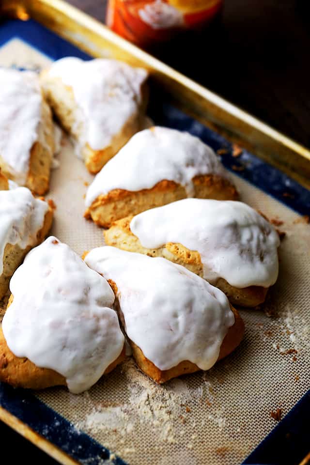 Pumpkin Pie Spice Cream Scones - Plump, rich, yet light and sweet scones flavored with pumpkin pie spice creamer and a simple spiced glaze.
