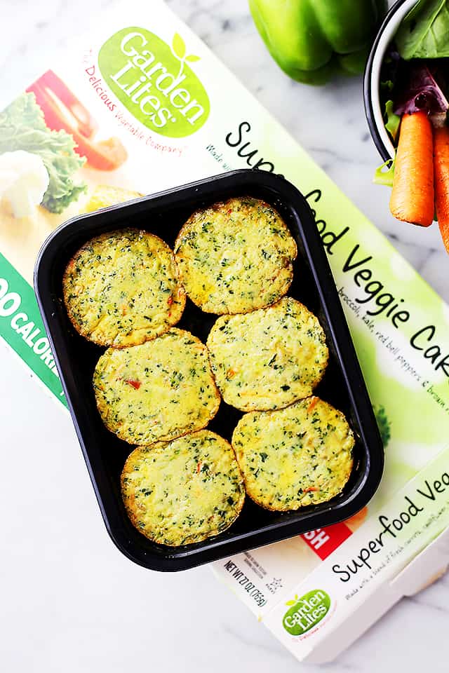 Overhead view of a 6-pack of Garden Lites Superfood Veggie Cakes in a black tray
