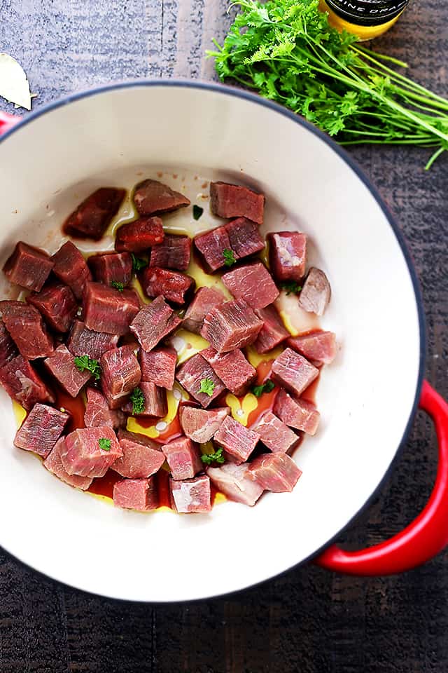 Beer Beef Stew Recipe - Super easy, but delicious and quick hearty stew cooked in a dutch oven with beef, mushrooms, carrots, and beer! 