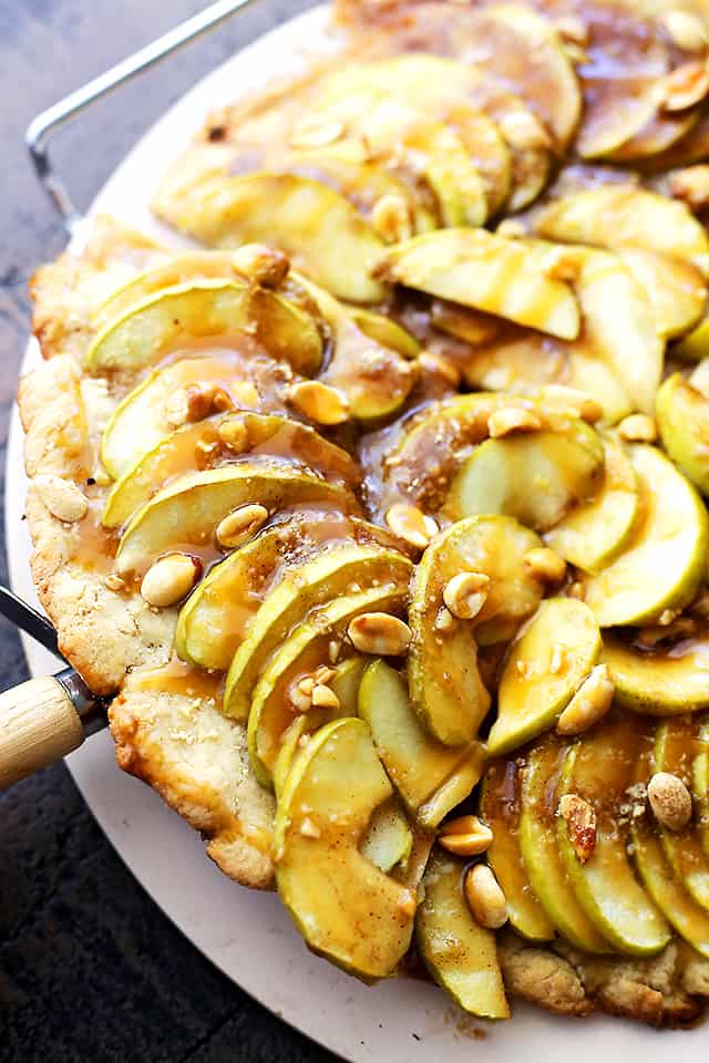 Gluten Free Caramel Apple Pizza with Streusel Topping - A delicious dessert pizza with a gluten free pizza crust, apples, a drizzle of caramel, and a sweet and crumbly streusel topping.