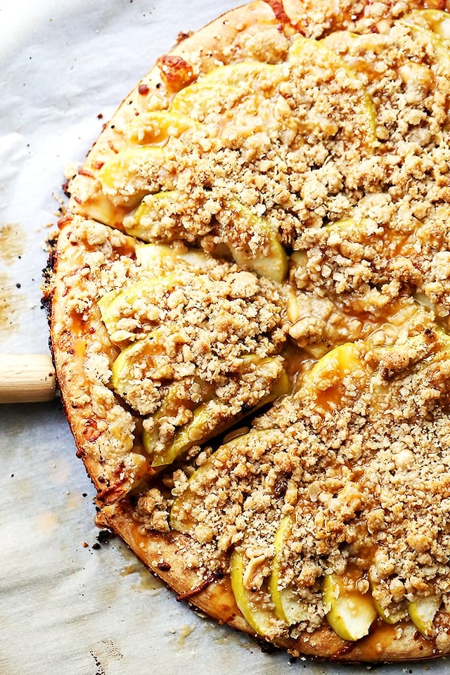 Gluten Free Caramel Apple Pizza with Streusel Topping - A delicious dessert pizza featuring a gluten free pizza crust, apples, a drizzle of caramel, and a sweet and crumbly streusel topping.