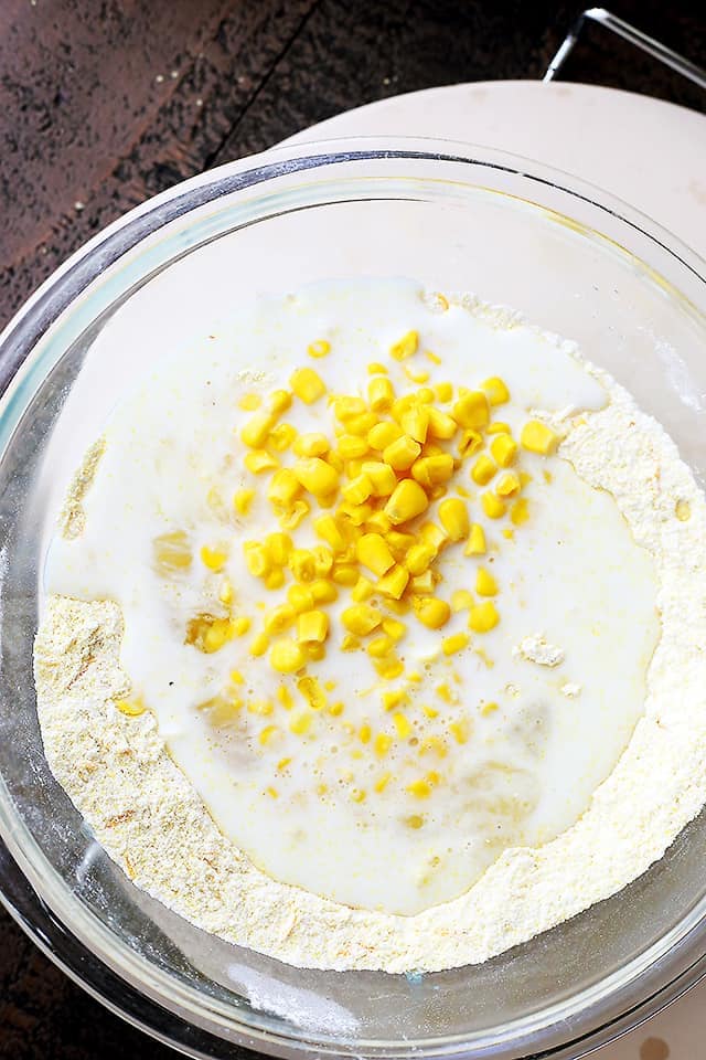 Kernels of sweet corn and sharp cheddar cheese are combined into the batter