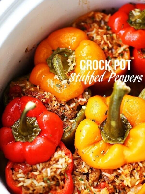 Crock Pot Stuffed Peppers - Loaded with spicy pork sausage, rice and tomatoes, these hearty and flavor-loaded peppers are the easiest and most perfect meal to serve to your family, and are also great for game day parties!