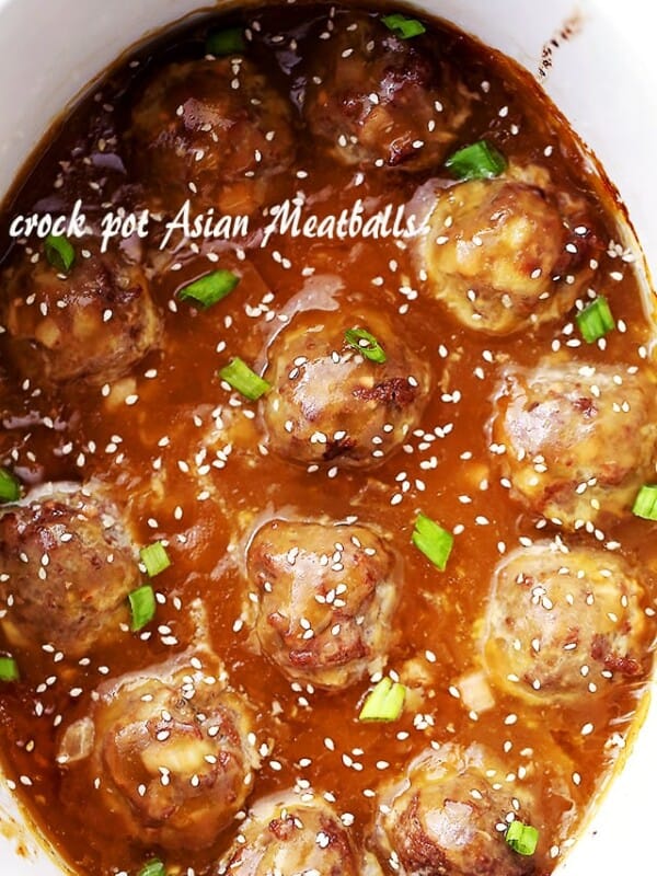 Crock Pot Asian Meatballs - Tender and juicy meatballs slow cooked in an amazing sweet and tangy pineapple-soy sauce. These are perfect for dinner, game days, or any and all celebrations!