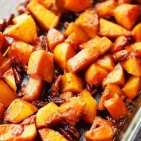 Roasted butternut squash with pecans in a mixture of honey and cinnamon.