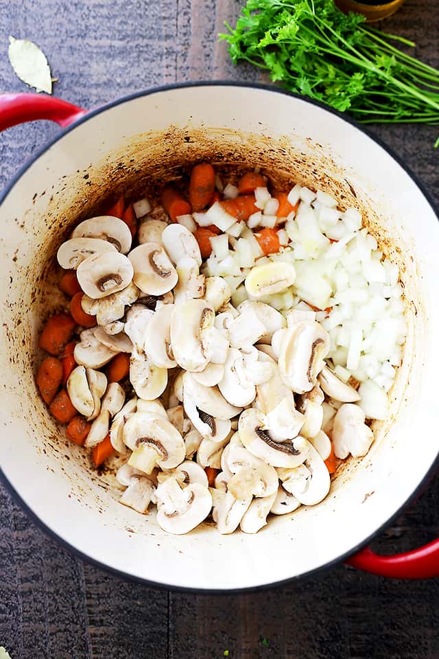 Beer Beef Stew Recipe - Super easy, but delicious and quick hearty stew cooked in a dutch oven with beef, mushrooms, carrots, and beer! 