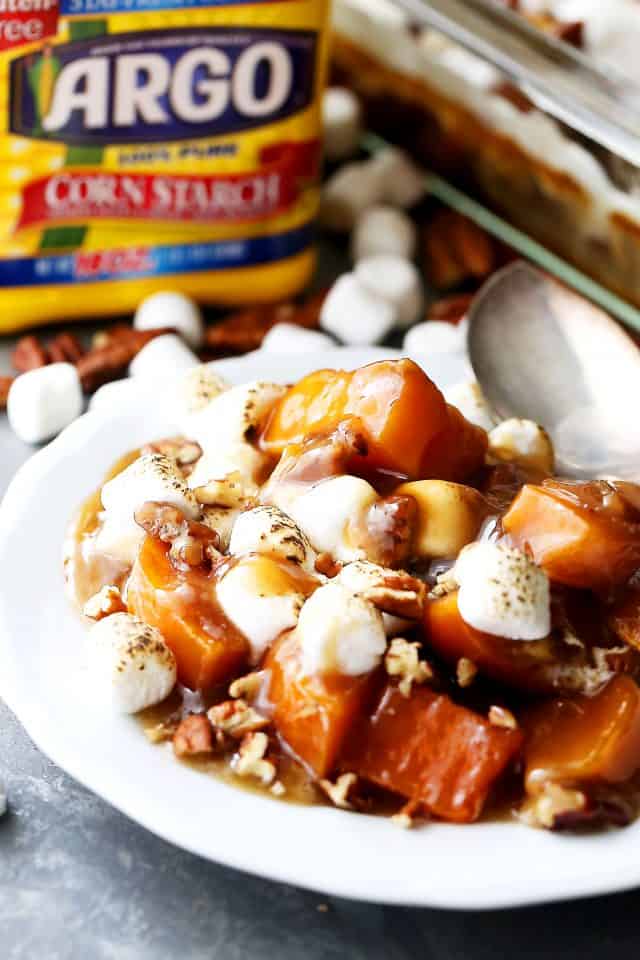 Orange and Pecans Sweet Potato Casserole - Delicious chunks of sweet potatoes baked in a luscious orange sauce, and topped with creamy marshmallows and crunchy pecans.