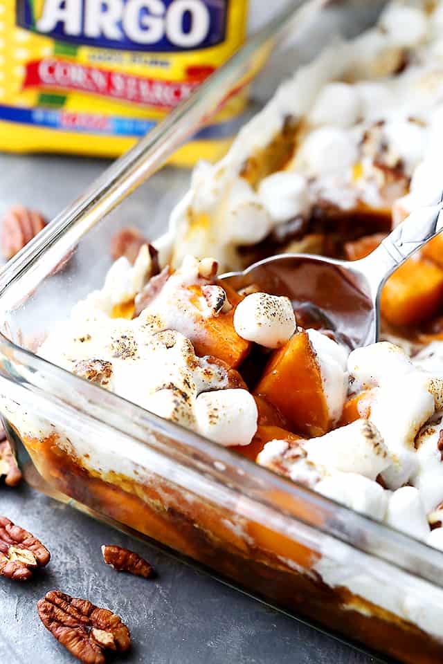 Orange and Pecans Sweet Potato Casserole - Delicious chunks of sweet potatoes baked in a luscious orange sauce, and topped with creamy marshmallows and crunchy pecans.