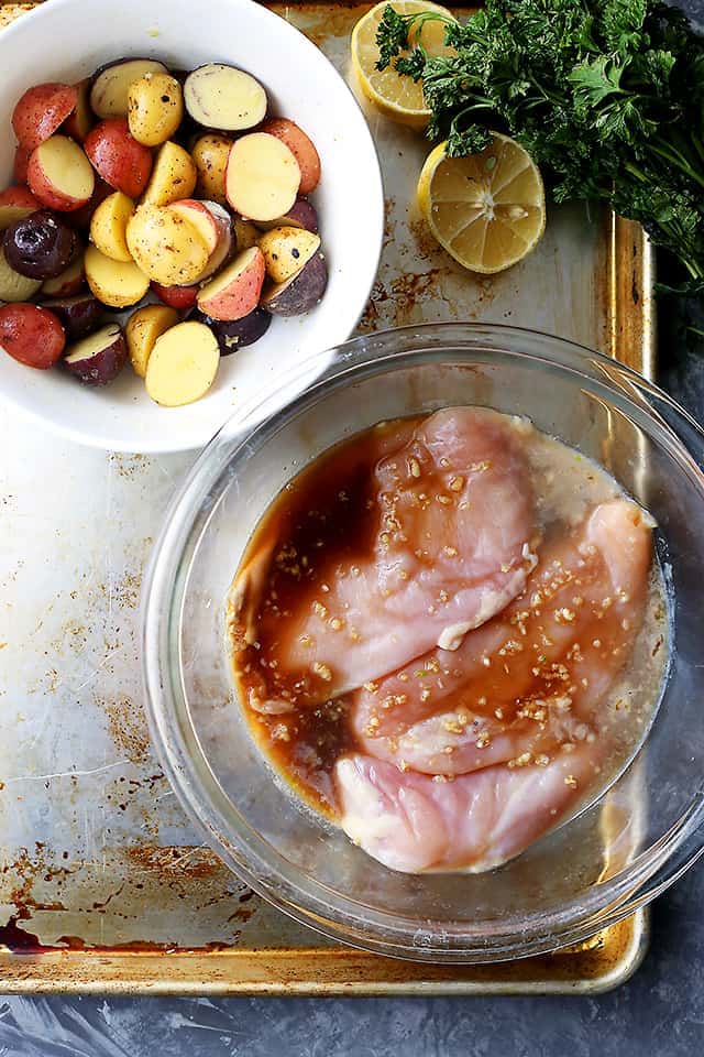 Sheet Pan Honey Garlic Lemon Chicken with Potatoes - Delicious and super easy weeknight dinner featuring flavorful and juicy chicken breasts cooked on a single pan with roasted potatoes!