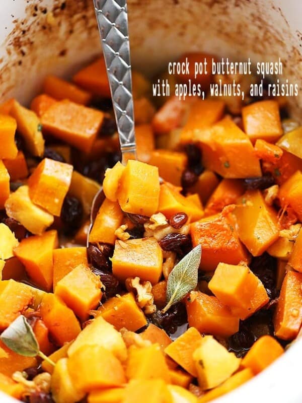 Crock Pot Butternut Squash with Apples, Walnuts and Raisins - This easy, delicious, and simple holiday side dish combines butternut squash, fresh apples, crunchy walnuts and sweet raisins cooked simply in the crock pot.