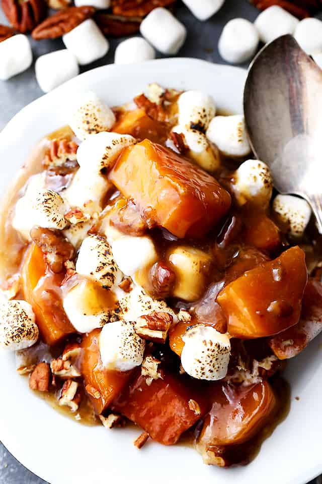 Orange and Pecans Sweet Potato Casserole - Delicious chunks of sweet potatoes baked in a luscious orange sauce, and topped with creamy marshmallows and crunchy pecans.
