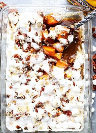 Orange and Pecans Sweet Potato Casserole - Delicious chunks of sweet potatoes baked in a luscious orange sauce, and topped with creamy marshmallows and crunchy pecans.