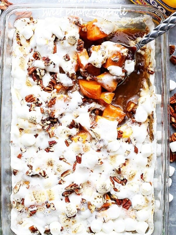 Orange and Pecans Sweet Potato Casserole - Delicious chunks of sweet potatoes baked in a luscious orange sauce, and topped with creamy marshmallows and crunchy pecans.