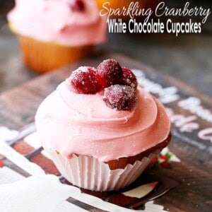 Sparkling Cranberry White Chocolate Cupcakes - Perfectly moist cupcakes filled with a creamy white chocolate ganache, and topped with a fresh cranberry frosting and sugared cranberries!