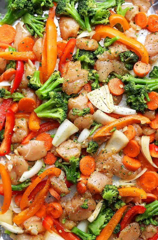 Sheet Pan Chicken "Stir Fry" - Just one pan and 30 minutes is all you will need to make this amazing meal! Skip the wok and make this quick and healthy chicken stir fry dinner in the oven!