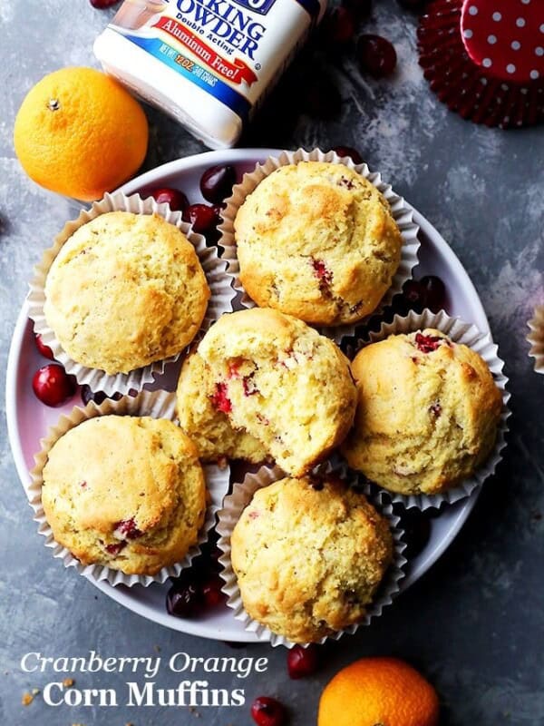 Overhead image of cornbread muffins served on a round plate.