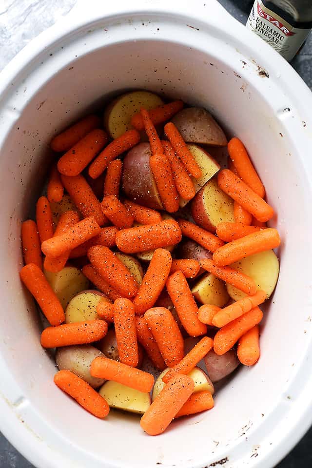 carrots and potatoes in a slow cooker.