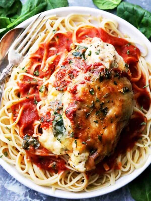 Saucy Spinach and Cottage Cheese Stuffed Chicken - Easy, delicious, yet healthy stuffed chicken breasts with spinach and cottage cheese, all baked in a hot and bubbly tomato sauce.