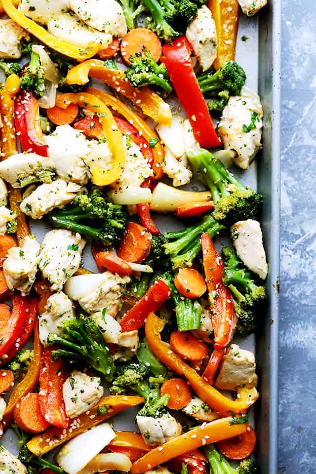 Overhead close up view of Asian sheet pan chicken and veggies.