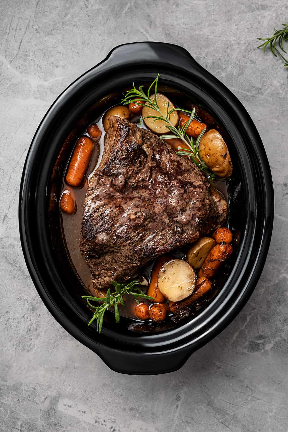 Slow cooker balsamic pot roast in a slow cooker.