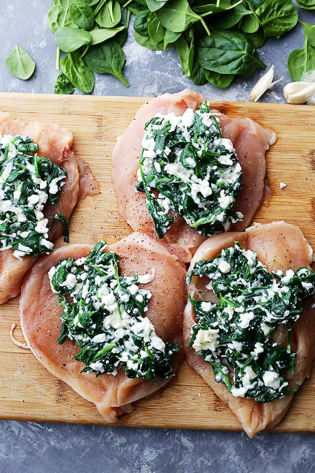 Spinach and Cottage Cheese spread over butterflied chicken breasts.