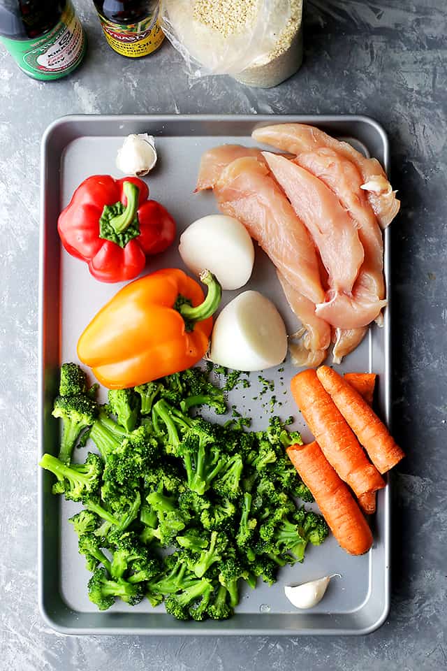 Sheet Pan Chicken "Stir Fry" - Just one pan and 30 minutes is all you will need to make this amazing meal! Skip the wok and make this quick and healthy chicken stir fry dinner in the oven!