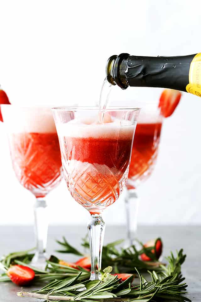 Rossini Cocktail - Festive, gorgeous, and delicious cocktail made with Prosecco and strawberry puree!