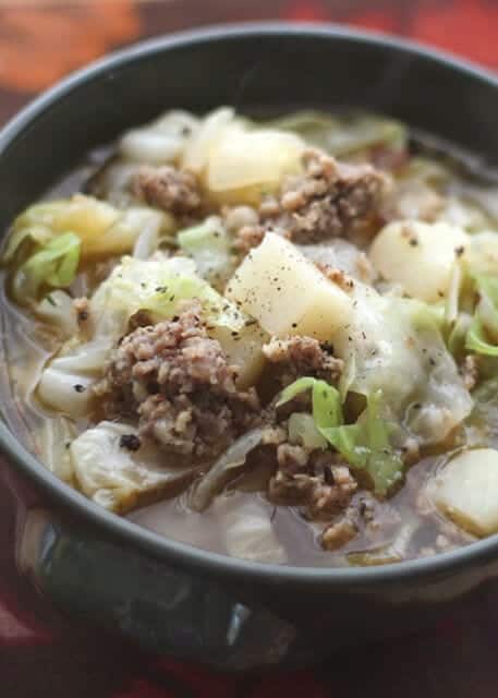 Cabbage Potato and Sausage soup in a bowl