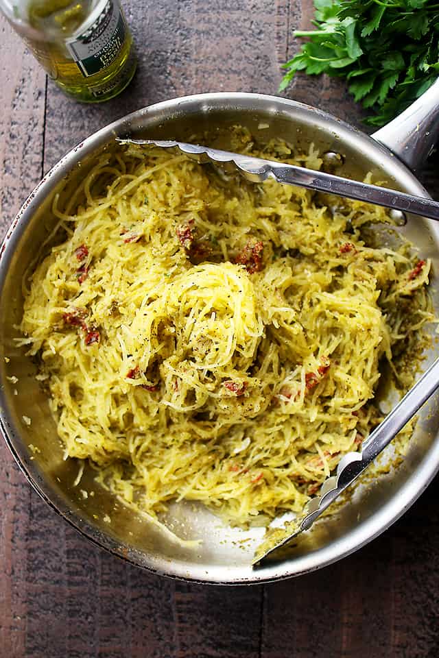 Basil Pesto Spaghetti Squash Pasta - An easy and healthy spaghetti squash pasta dinner tossed with basil pesto and sun dried tomatoes. 