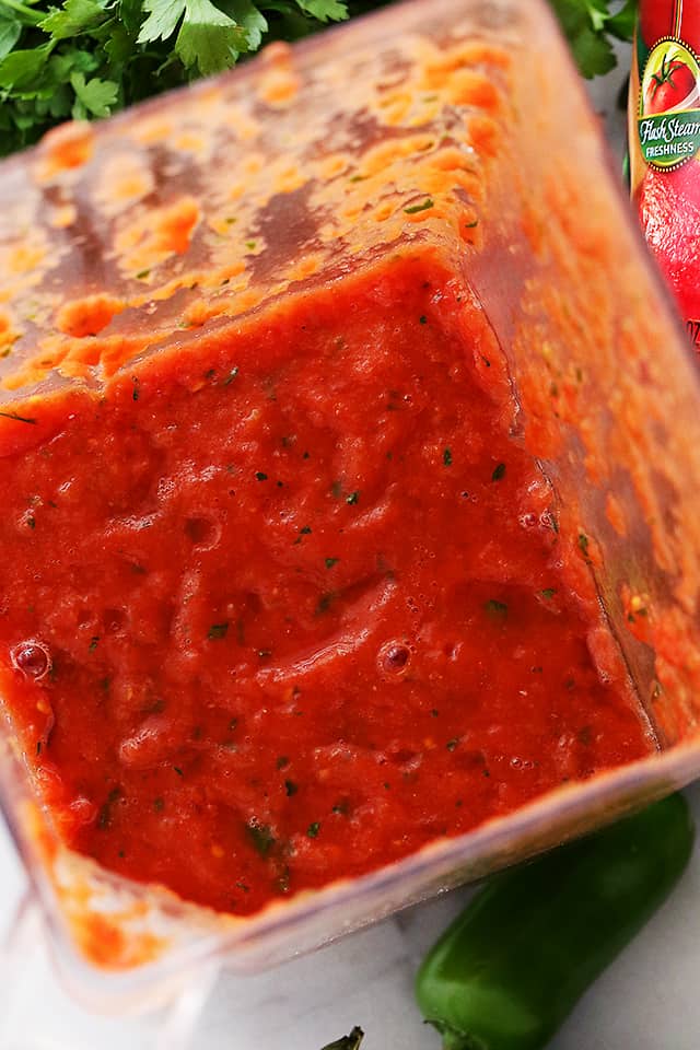 Homemade Restaurant Style Salsa - Super easy to make chunky homemade salsa made with delicious ingredients, and 1000x better than any store-bought version. Takes minutes to whip up and tastes amazing!