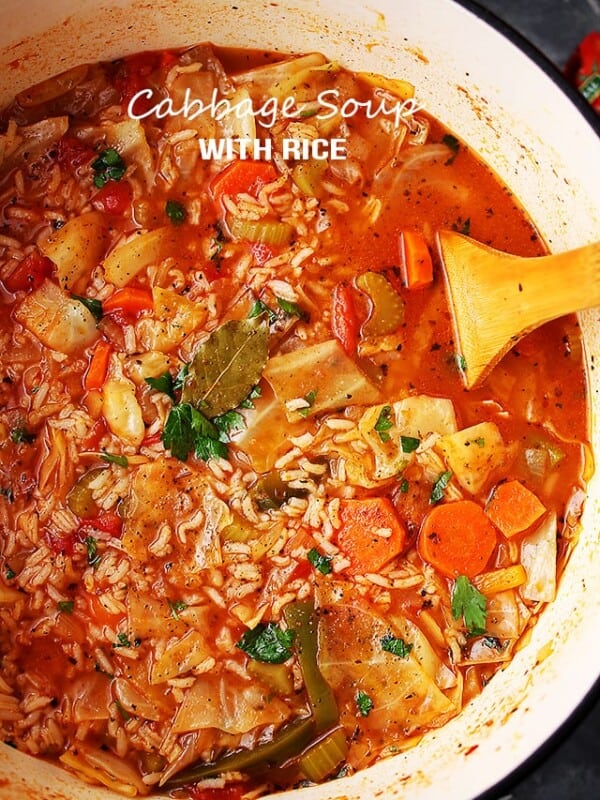 Cabbage soup with rice in a soup pot.