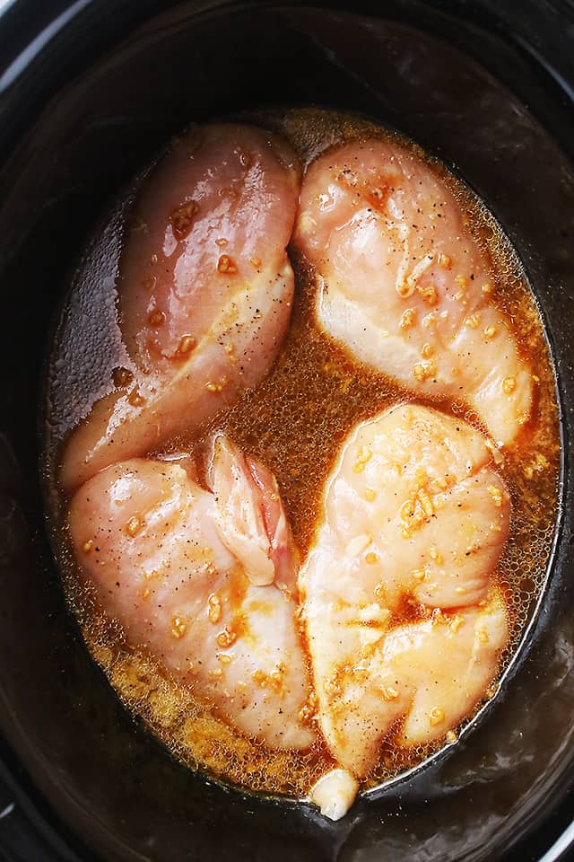 Crock Pot Garlic Lime Chicken - Chicken breasts simmered in an amazing garlic and lime mixture, and cooked to a tender perfection!
