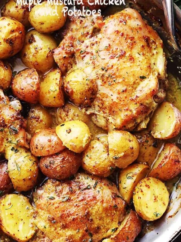 Maple Mustard Chicken and potatoes in a skillet.