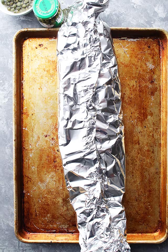 A whole fillet of Salmon wrapped in foil.