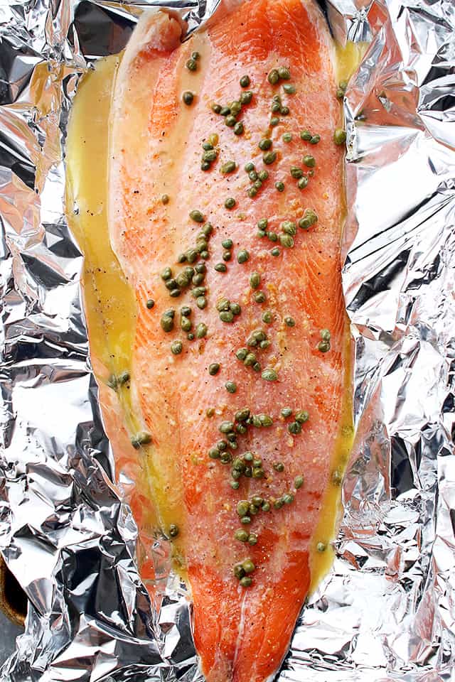 Flourless Salmon Piccata in Foil - A healthy and incredibly delicious dinner with flourless piccata sauce poured over salmon and cooked in foil.