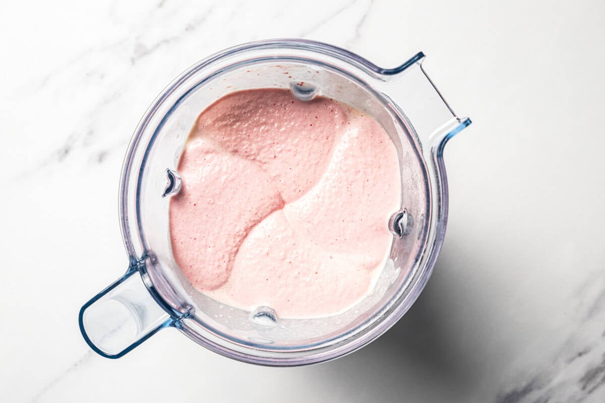 A blended protein shake in the blender's jar.