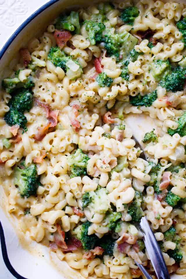 Close up of broccoli bacon mac and cheese in a large skillet.