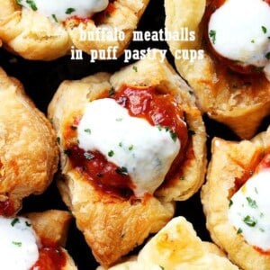Buffalo Meatballs in Puff Pastry Cups - Delicious buffalo sauce meatballs stuffed inside baked puff pastry cups and topped with blue cheese dressing!