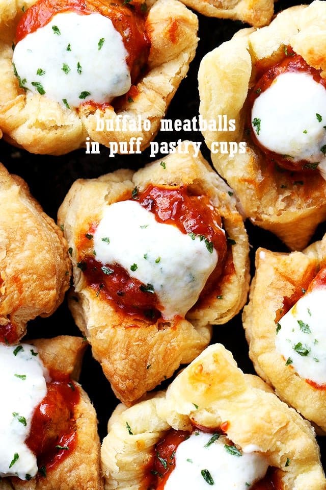 close up of Buffalo Meatballs in Puff Pastry Cups drizzled with blue cheese dressing