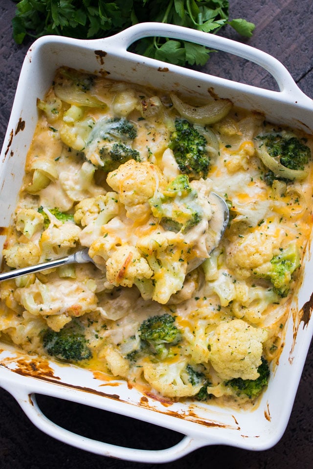 Garlicky and Cheesy Cauliflower Broccoli in a white baking dish.