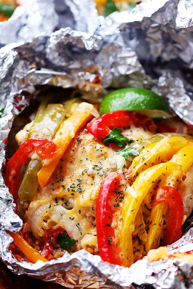 Chicken and Rice Fajitas in Foil - Incredibly delicious and easy to prepare fajitas with chicken, peppers, onions and rice all cooked in foil packets. Easy, quick and SO GOOD!