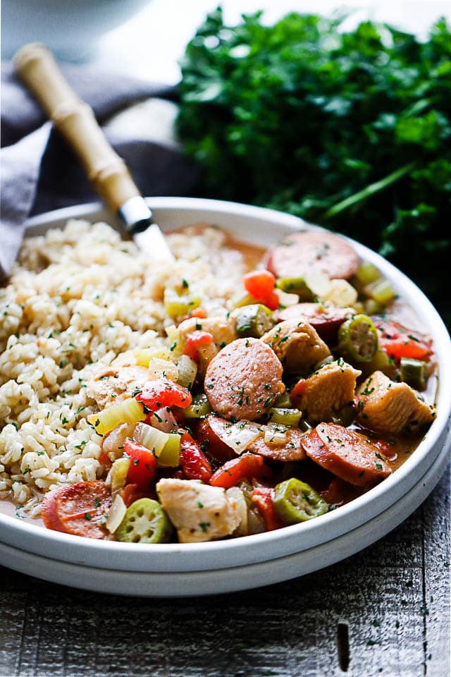 Chicken and Sausage Gumbo - Quick to make, incredibly delicious gumbo loaded with chicken, sausage, okra, peppers, tomatoes, and served over brown rice.