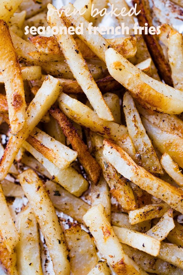 Close-up image of oven-baked seasoned french fries.
