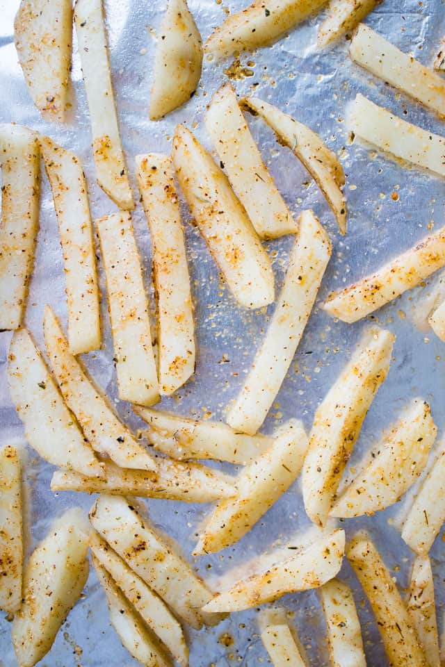 French fries arranged on a baking sheet.