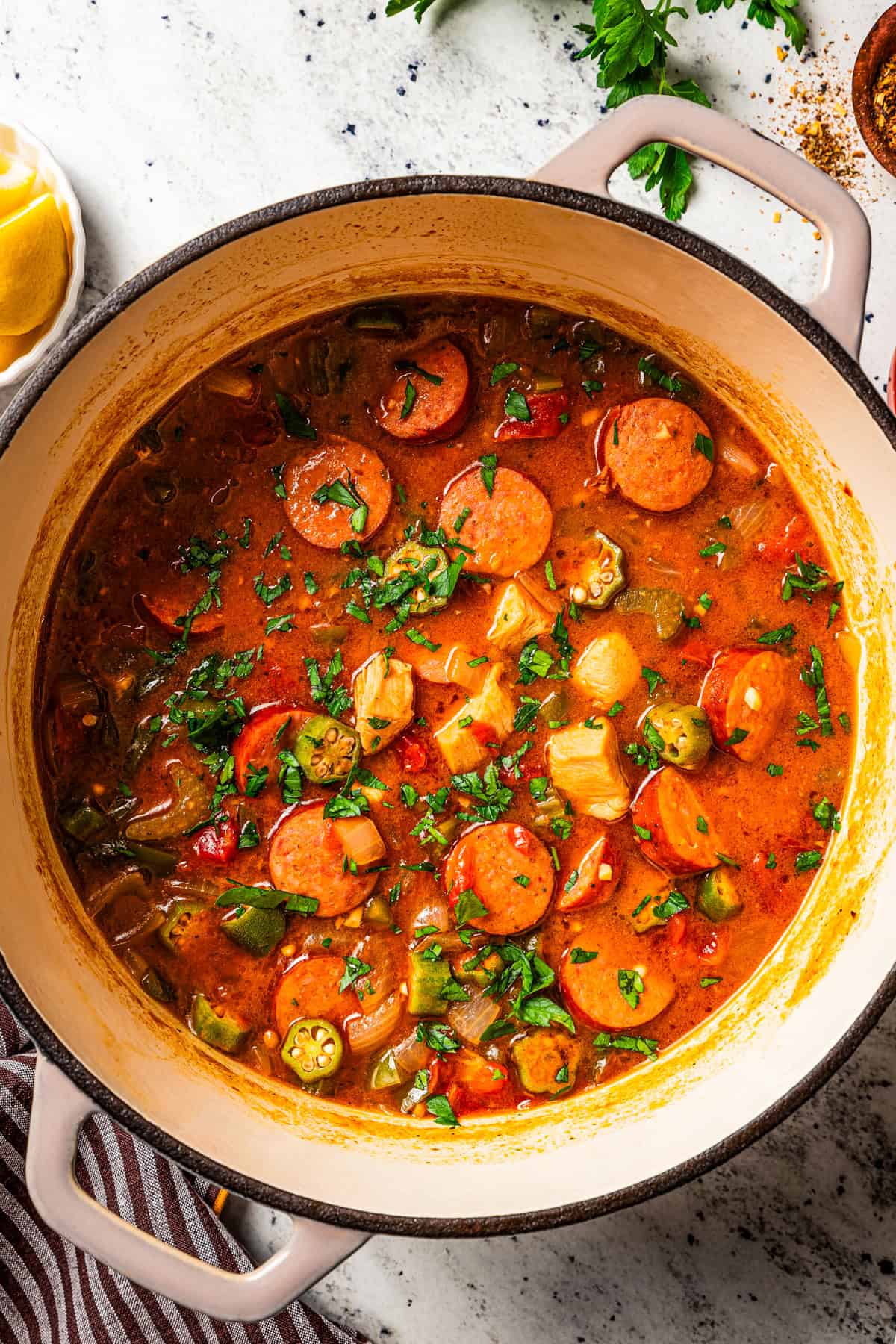 Overhead view of a pot of chicken and sausage gumbo.