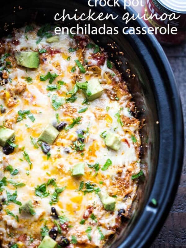 Crock Pot Chicken Quinoa Enchiladas Casserole - Packed with chicken, tomatoes, quinoa, and more, this enchiladas casserole is healthy, delicious, and it's prepared in the crock pot.