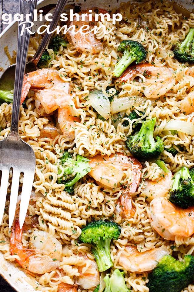 Close-up image of ramen noodles mixed with shrimp and broccoli florets.
