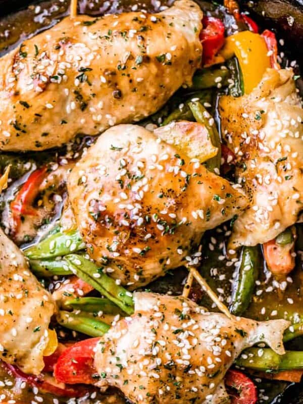 Honey Garlic Chicken and Vegetables Rollups - Quick and easy chicken breast rollups stuffed with colorful vegetables and cooked in an amazing honey garlic sauce.