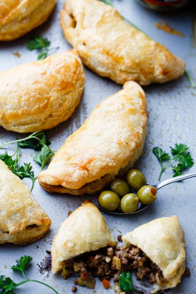 Beef Empanadas with Olives - Made with puff pastry dough, and filled with an incredible beef and olives mixture, these empanadas are quick to prepare and they're absolutely delicious! 