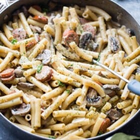 One Pot Creamy Ziti with Andouille Sausage and Mushrooms - This wonderful creamless creamy ziti pasta dinner is jam packed with delicious andouille sausages and mushrooms, and it's prepared in one pot and on the stovetop!